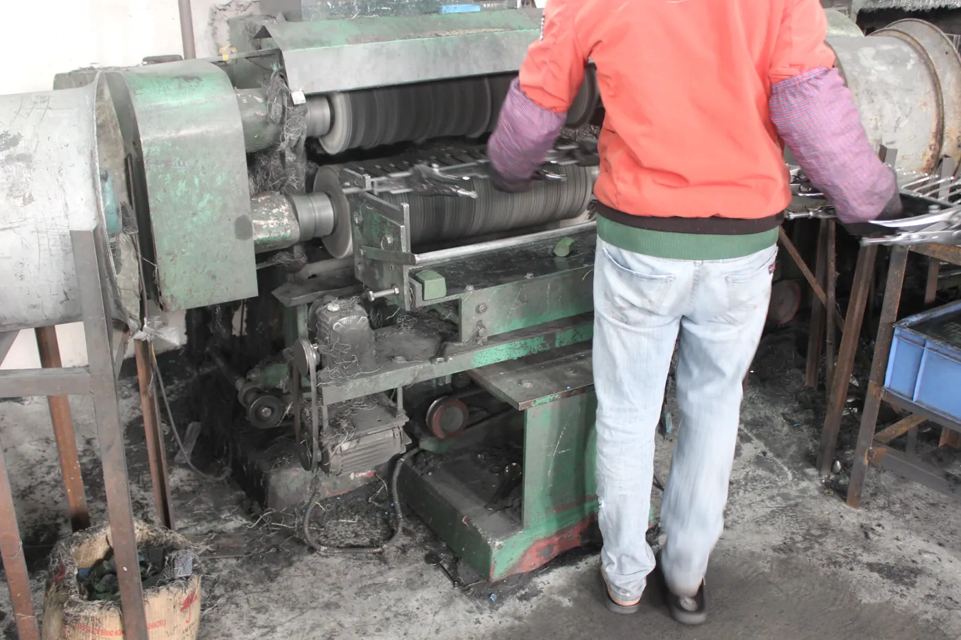 Worker polishing stainless steel surface finish